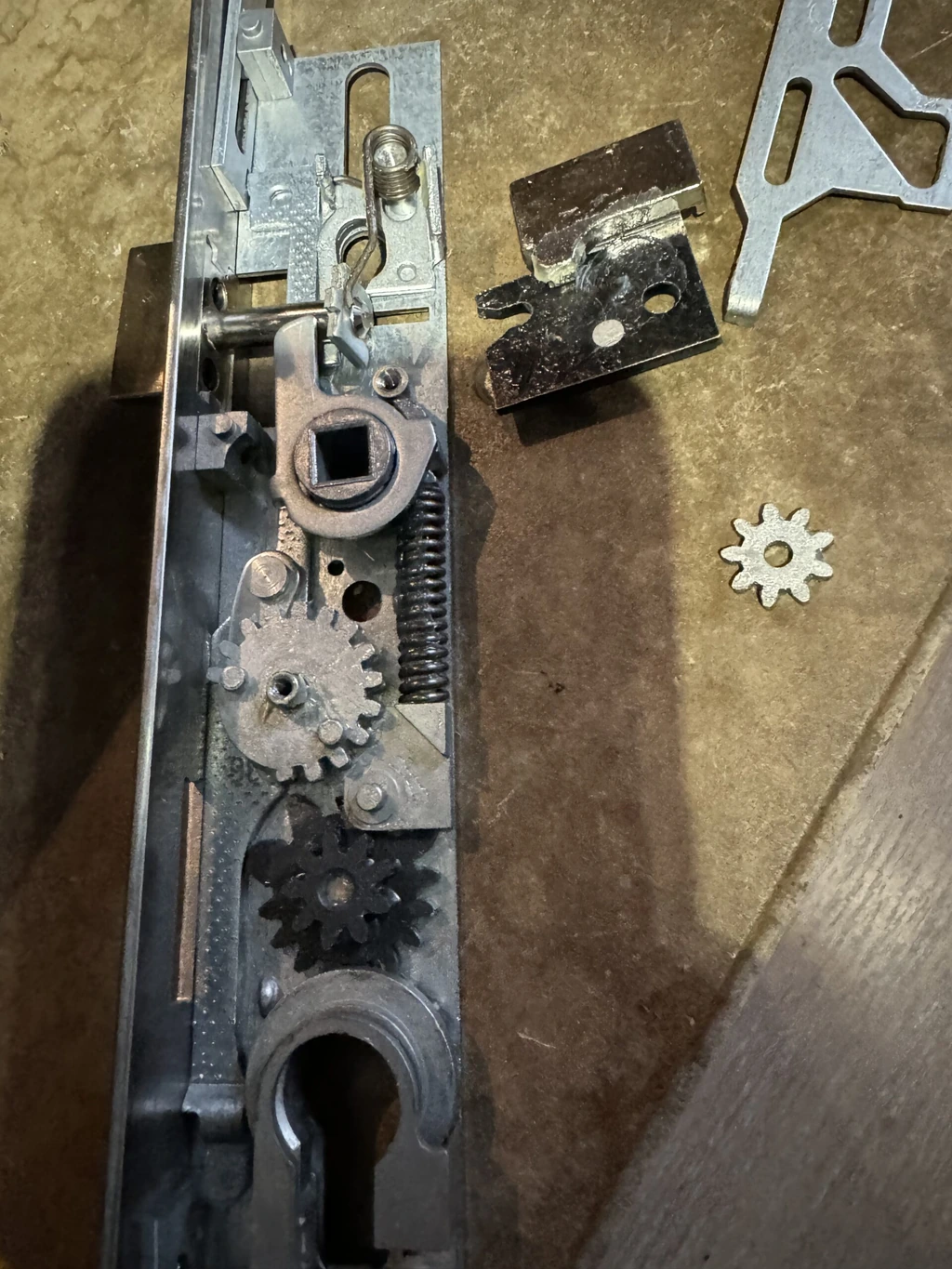 Lock disassembled with gear mechanisms and lock components — MULTISECU